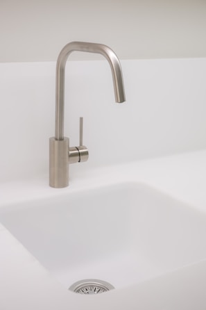 A sleek bar faucet that adds modern flair to any sink.