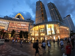 Evening exterior shot of St James Shopping Centre illuminated against the Edinburgh skyline.