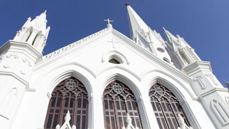 Outside view of Luzviva church with its modern architecture against a bright blue sky.