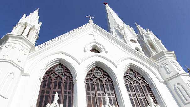 Outside view of Luzviva church with its modern architecture against a bright blue sky.