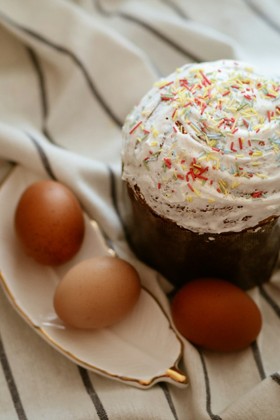 chocolate cake with white icing on white ceramic plate