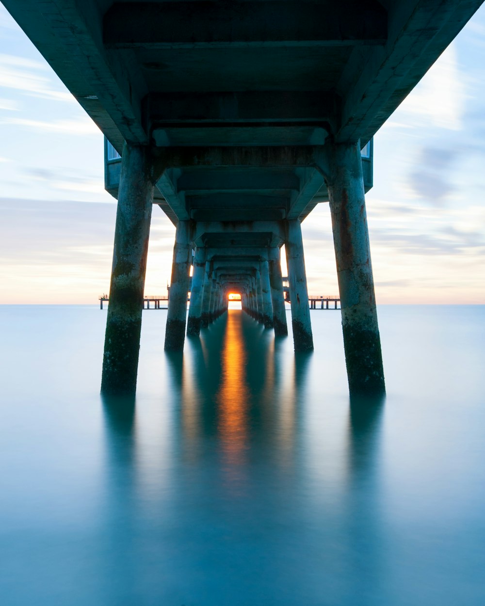 gray concrete bridge over the sea