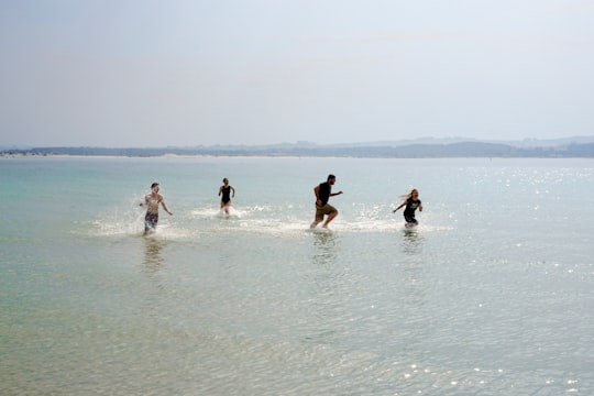 people in beach during daytime in Solastranden Norway