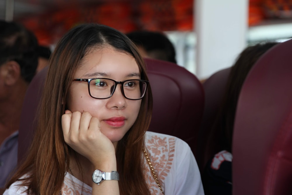 woman in white shirt wearing eyeglasses