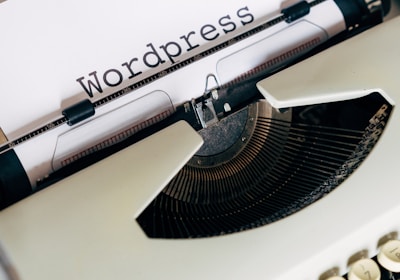 white and black typewriter on white table