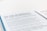 A document page with blue and white background text detailing new arrangements for TV licenses for individuals over 75. The text mentions the end of free TV licenses funded by the government and provides information regarding eligibility and application.