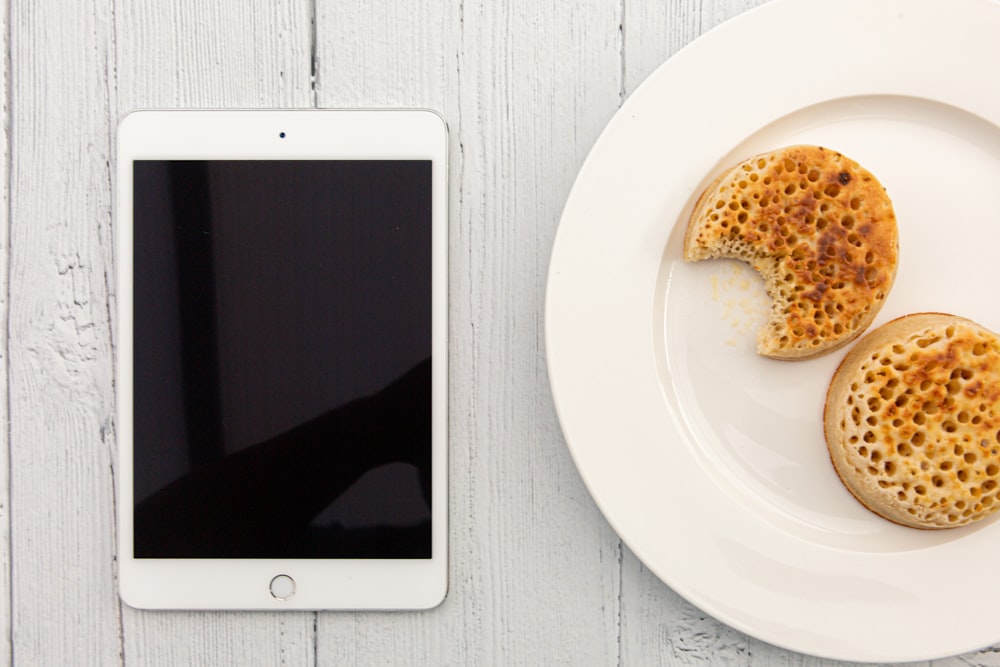 white ipad on white table