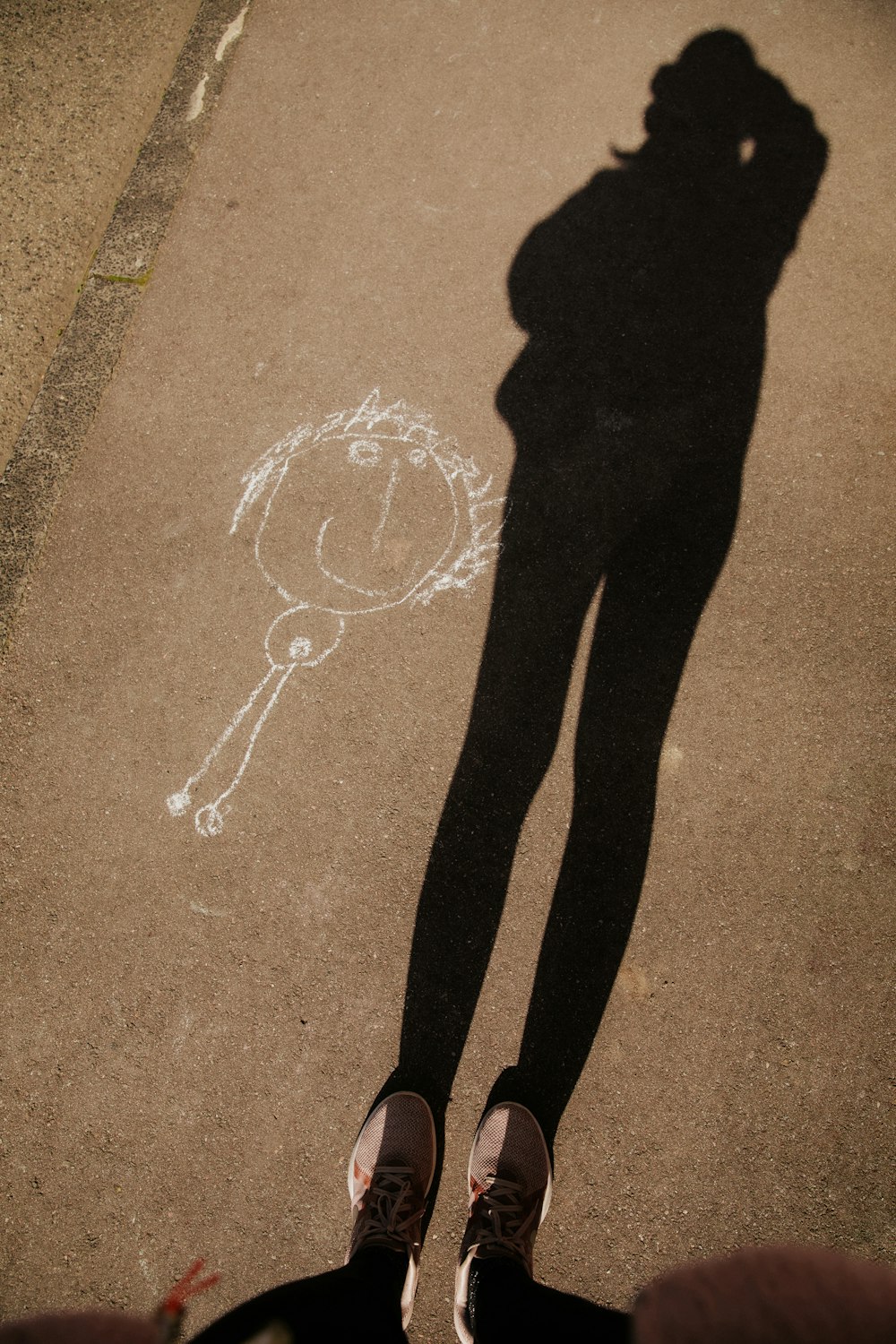 person standing on brown concrete floor