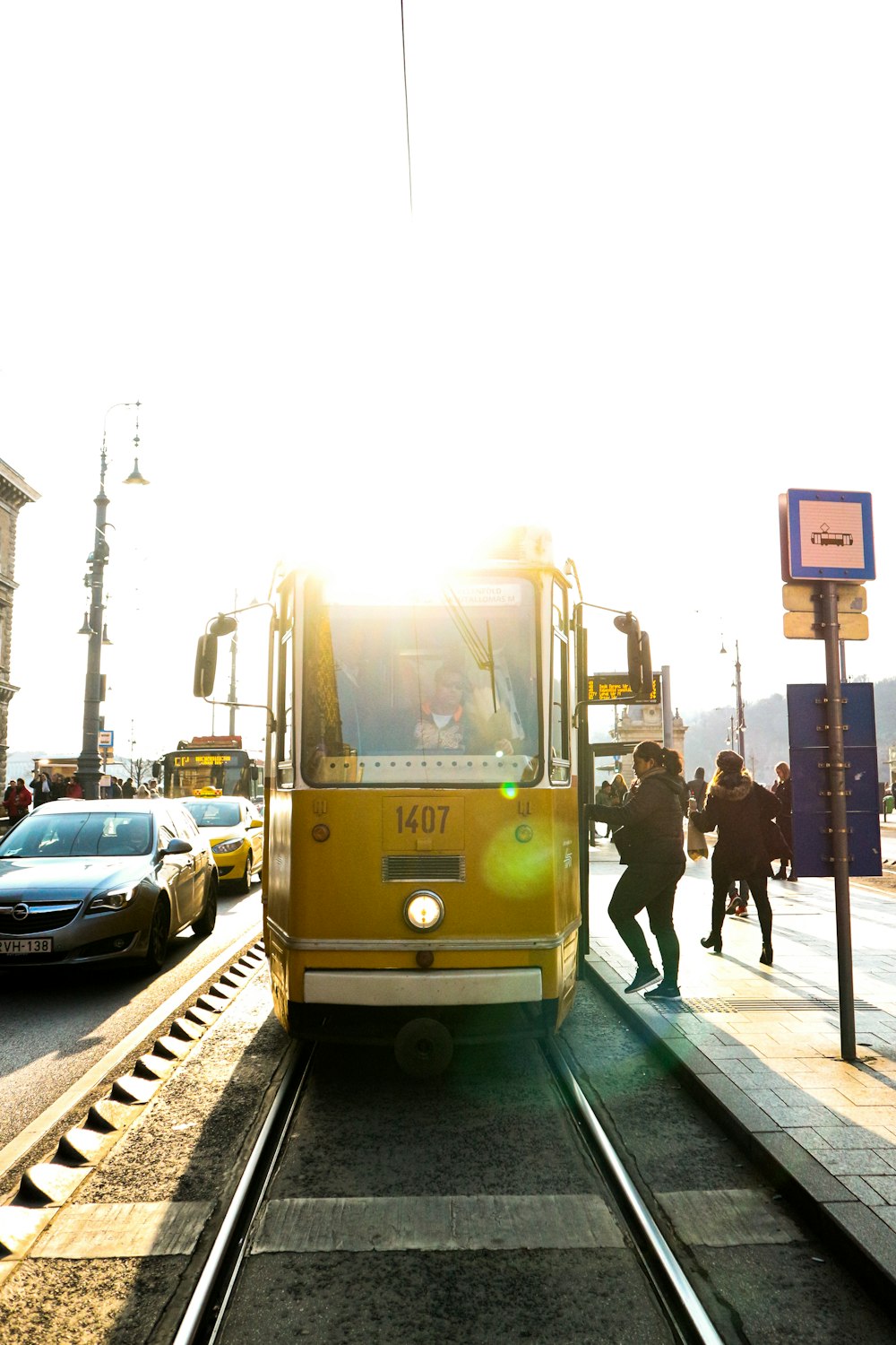 yellow and white tram on road during daytime