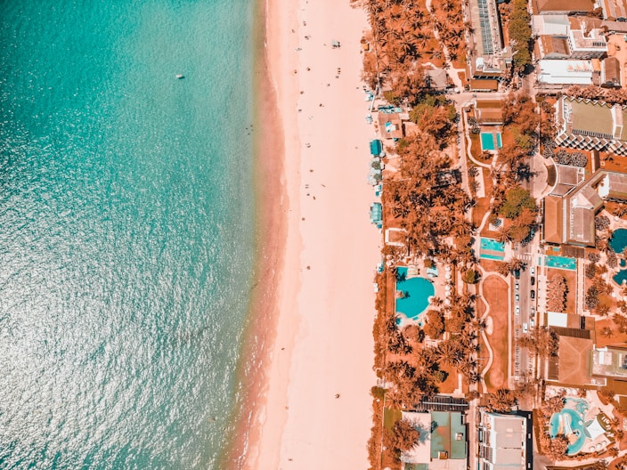 aerial view of city near body of water during daytime