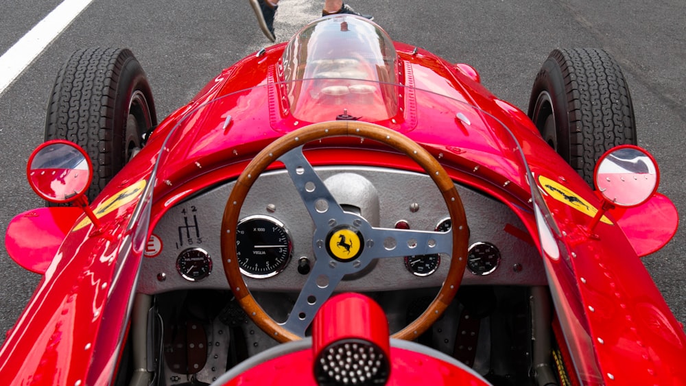 red and silver car steering wheel