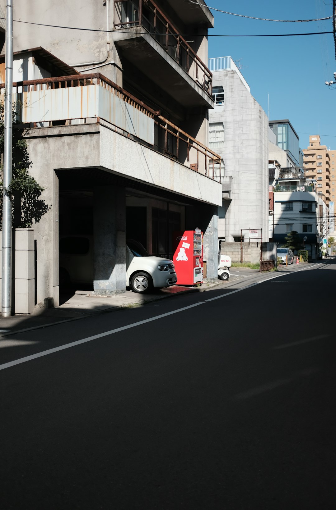 white and red car on road during daytime