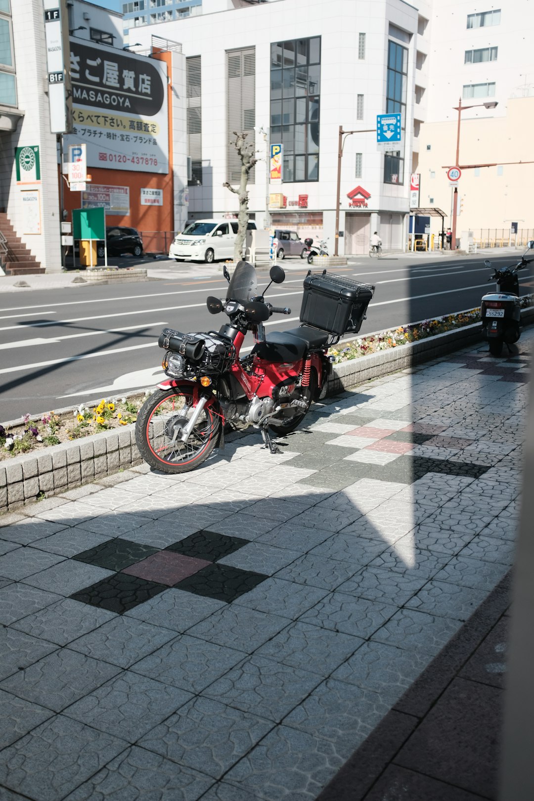 man in black jacket riding on black motorcycle on road during daytime