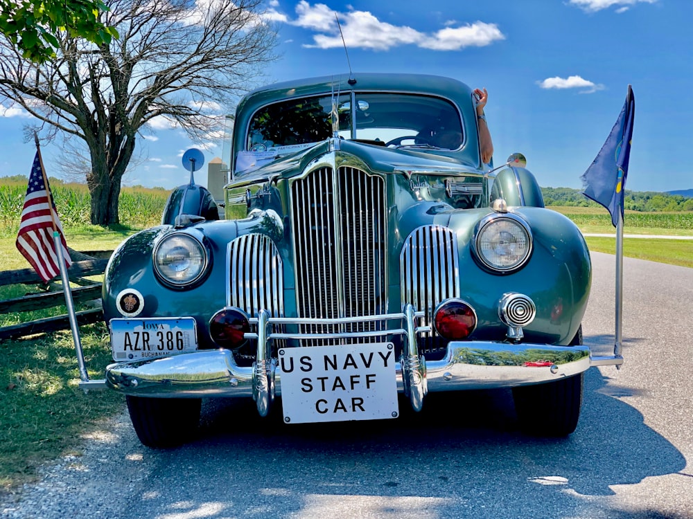 vintage blue car on road during daytime