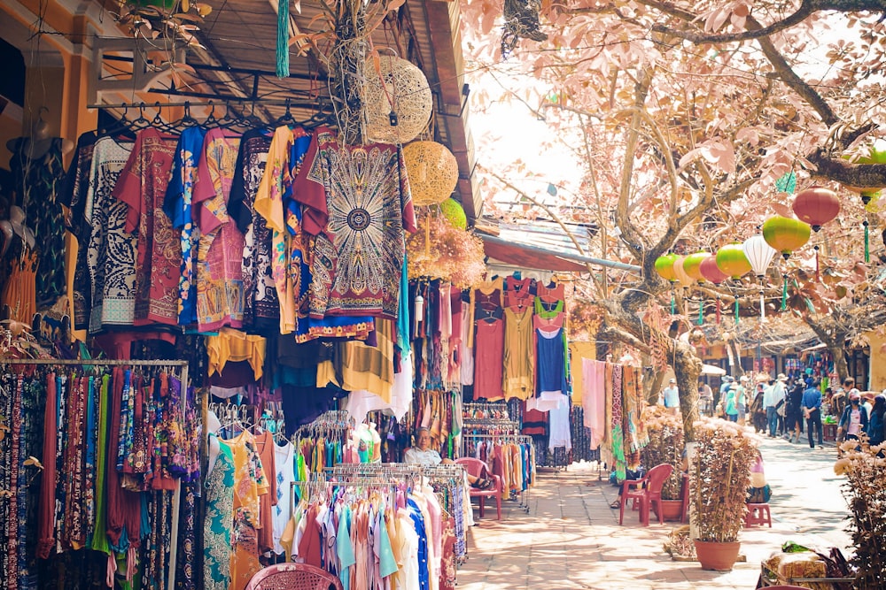 assorted clothes hanged on clothes line during daytime