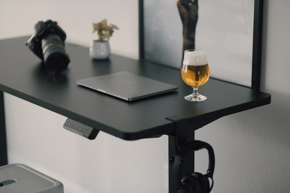 clear glass mug on black wooden table