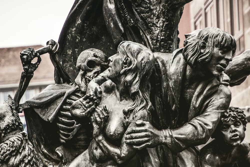 man holding a baby statue