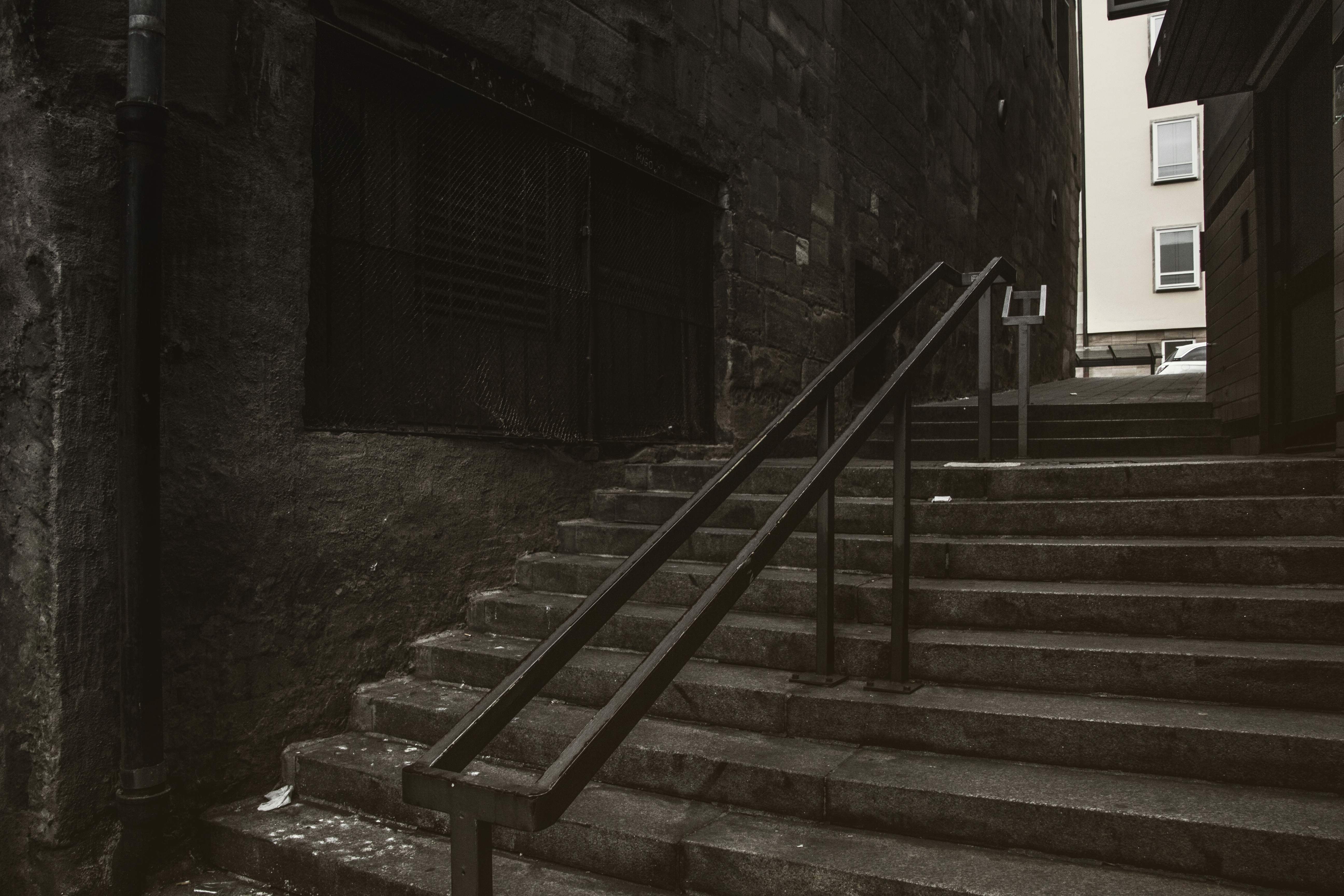grayscale photo of concrete stairs