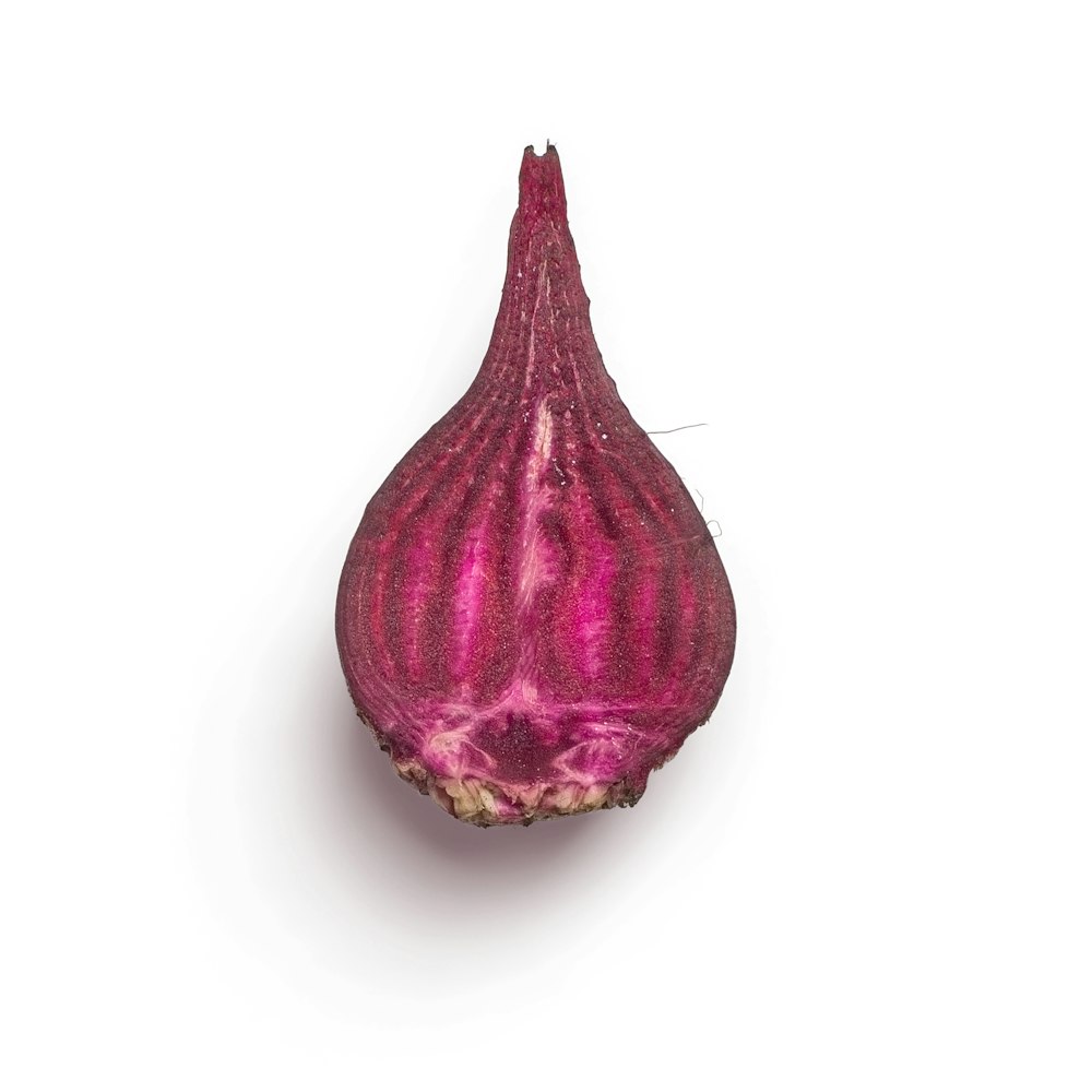 purple onion on white surface