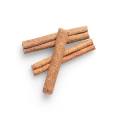 four brown biscuits on white background