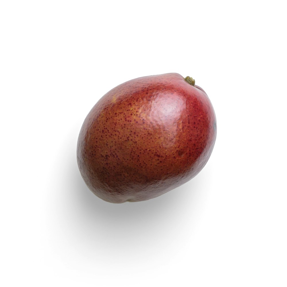 red apple on white surface