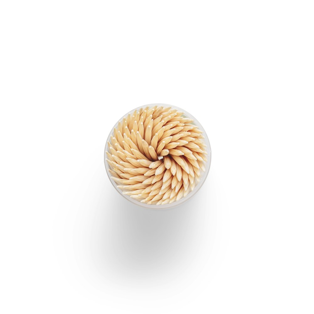 brown round ornament on white surface