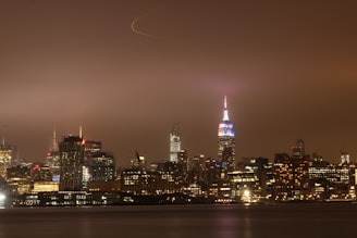 A nighttime shot of a cityscape representing 24-hour service availability across the USA.