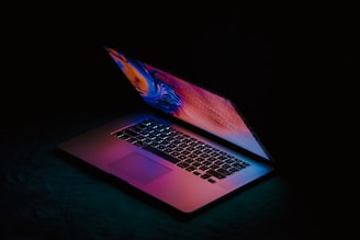 macbook pro on black textile