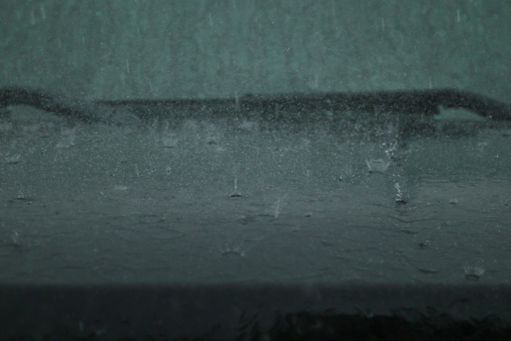 water droplets on gray concrete wall