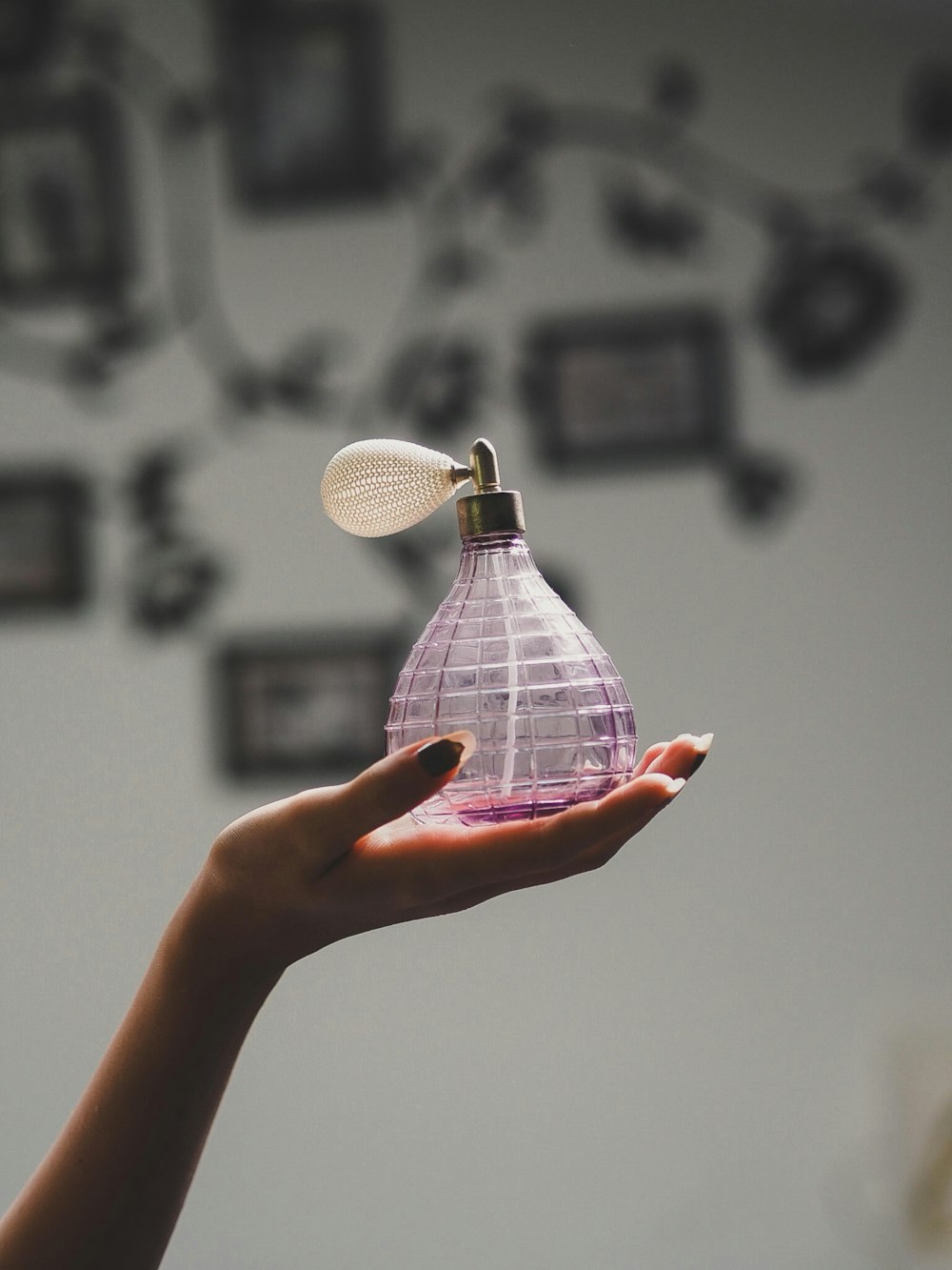 person holding white and black checked paper lantern