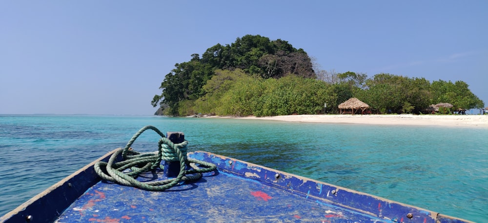 green and brown island surrounded by body of water during daytime