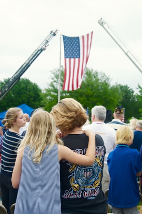 people standing and walking on street during daytime
