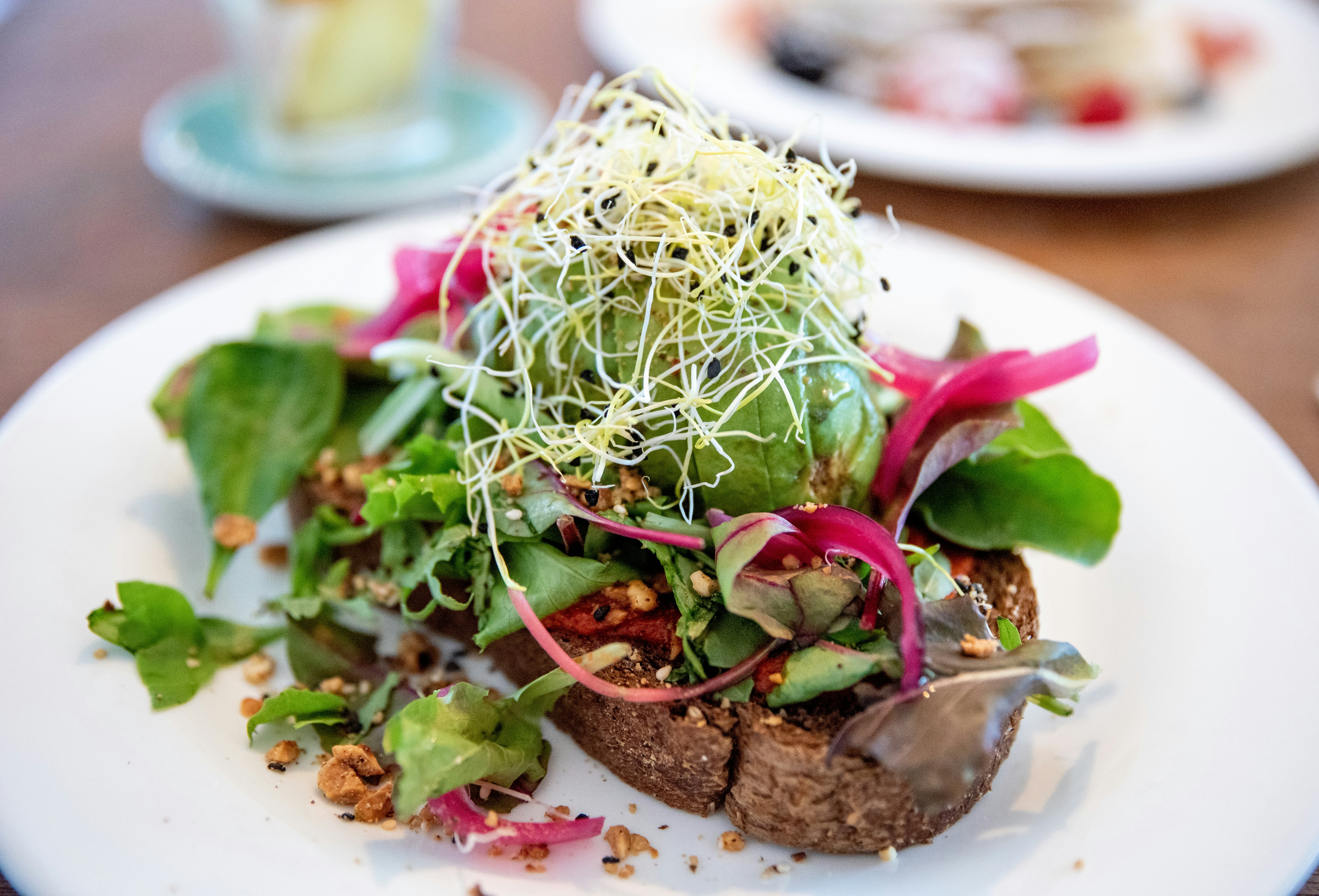 green vegetable on white ceramic plate, From the breakfast club Amsterdam