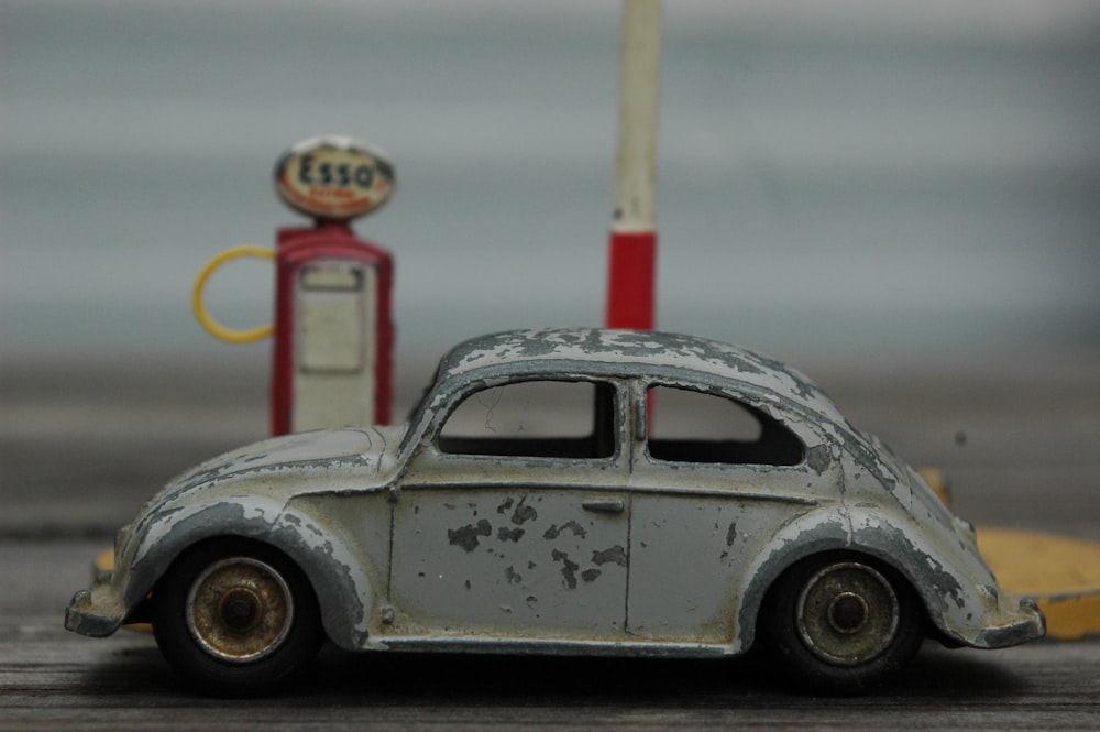 white volkswagen beetle on road during daytime