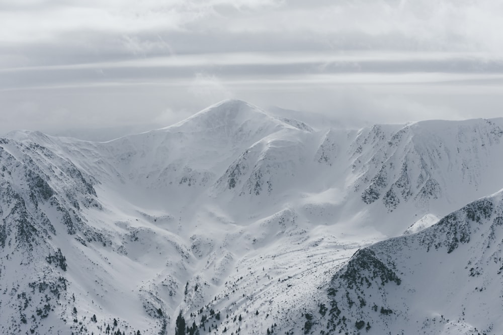 snow covered mountain during daytime