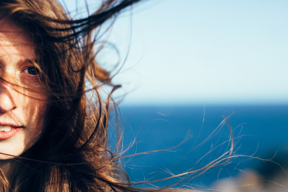 brown haired woman in blue shirt