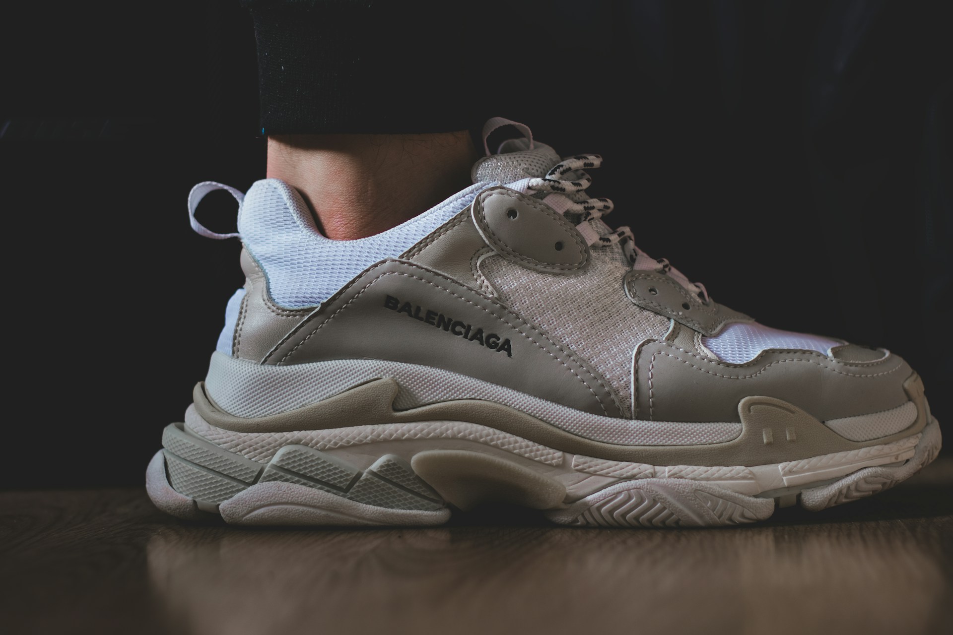 person wearing white nike air max