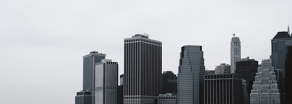 city buildings under white sky during daytime