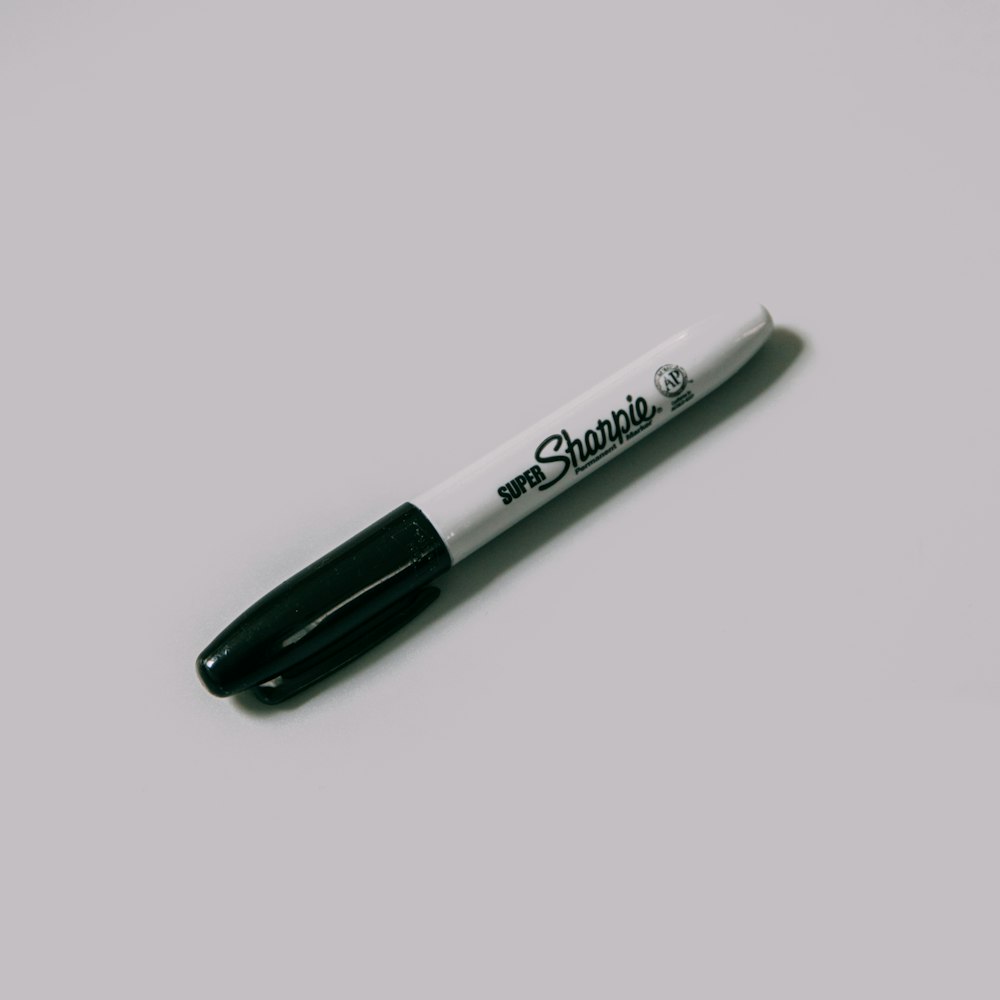 sharpie fine point pen on white surface