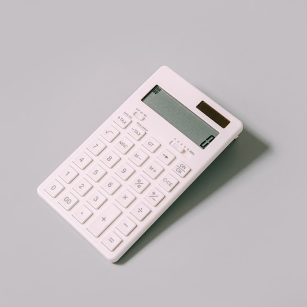 white calculator on white tableby charlesdeluvio