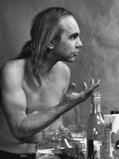 A serene portrait of Sébastien Gougeon engaged in a thoughtful conversation with a client.