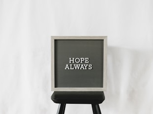 a sign that says hope always on it