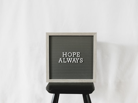 a sign that says hope always on it