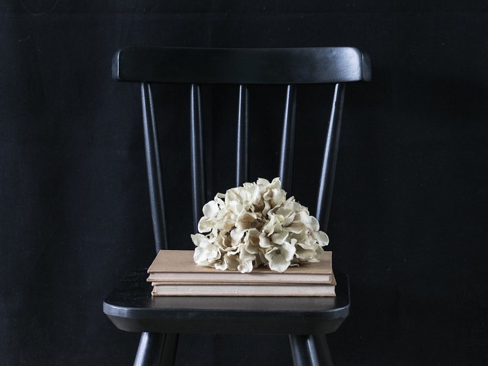 brown wooden chair with white mushrooms