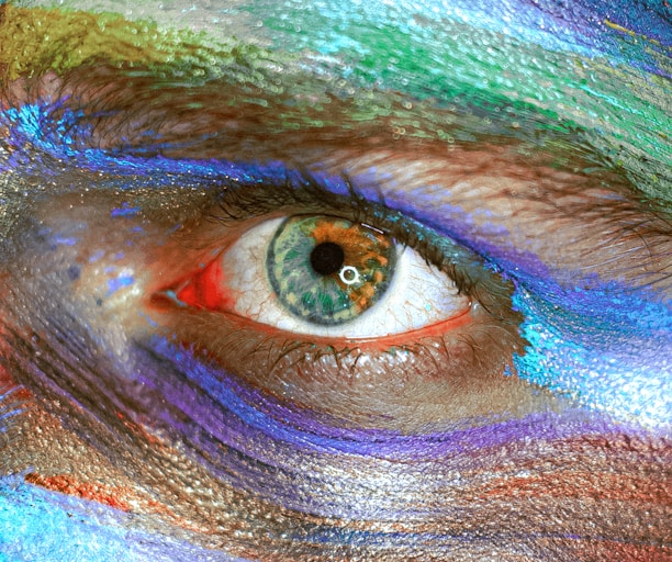 person with blue and green eye