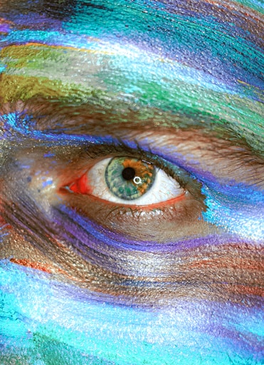 person with blue and green eye