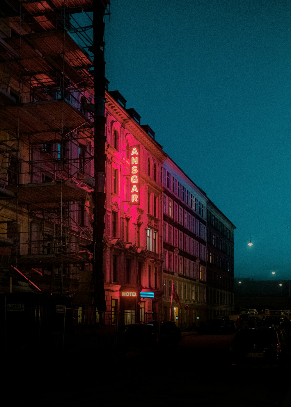 red concrete building during night time