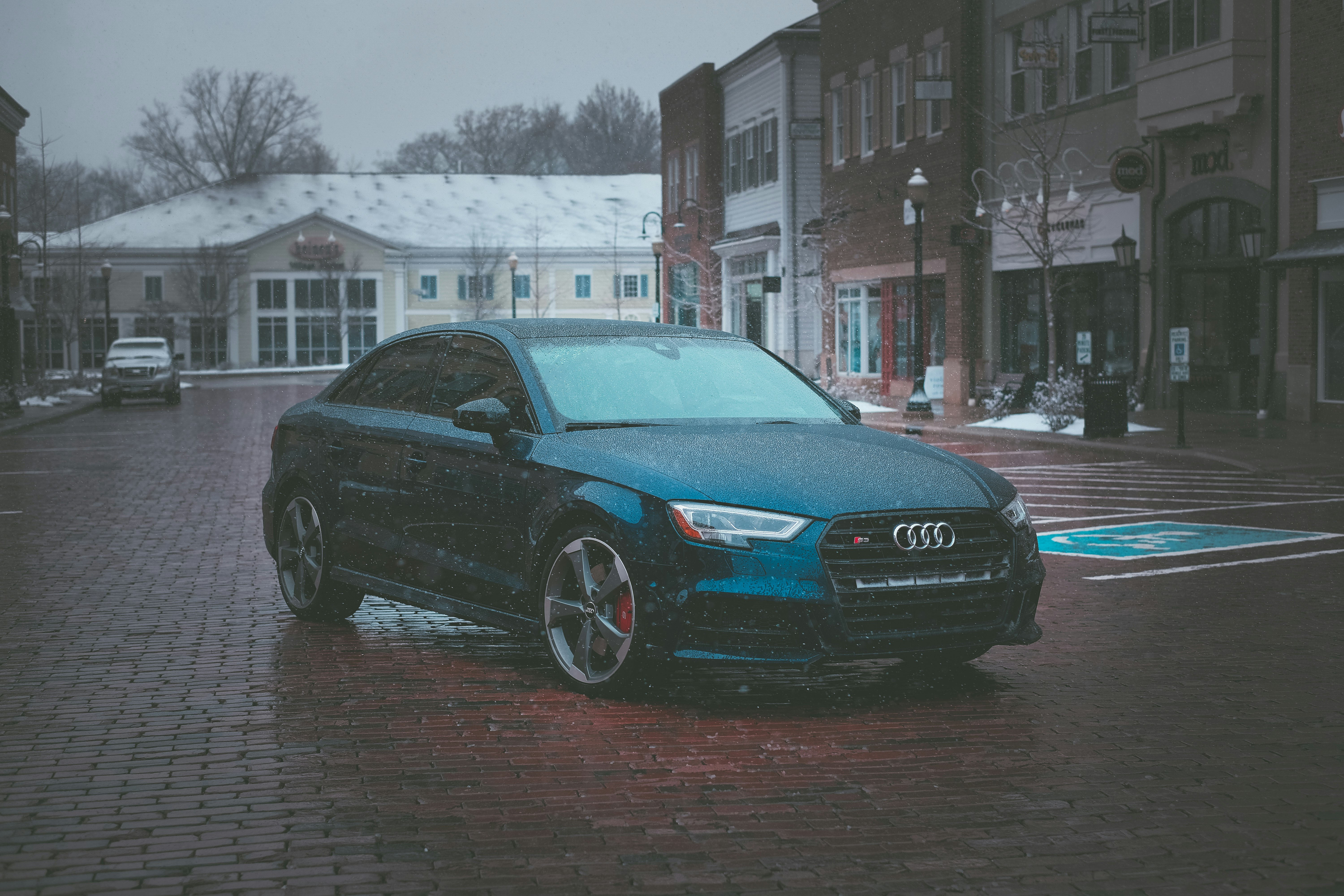 black audi sedan on road during daytime