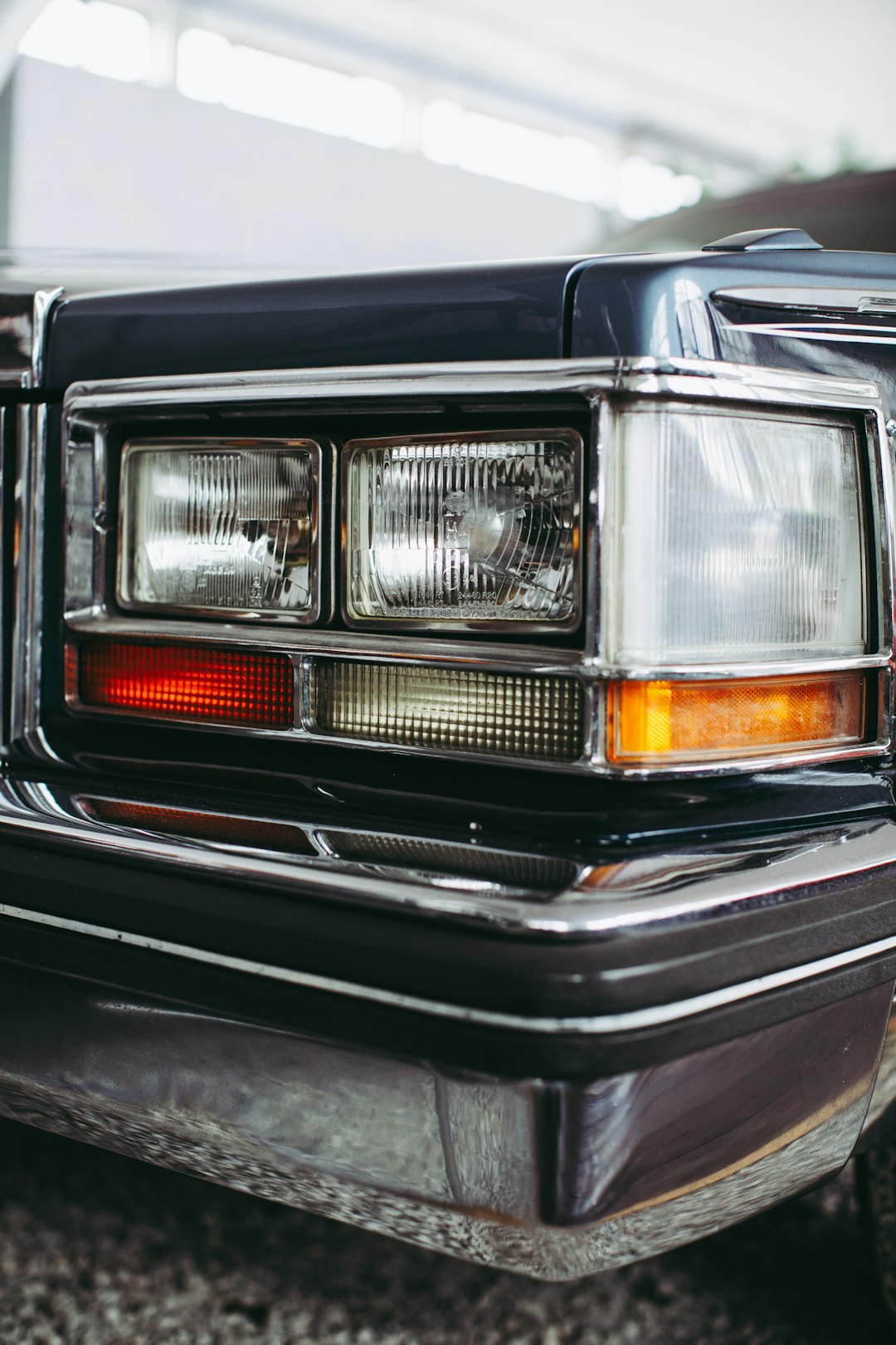 black and orange car with white lights