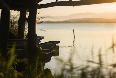 white boat on body of water during sunset santa's list google meet background